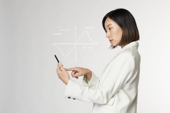 Futuristic digital presentation by a businesswoman in white