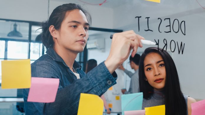 Group of young businessman and businesswoman brainstorming ideas